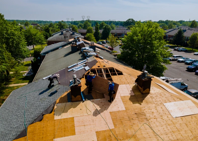 Roof repair with workers and tools