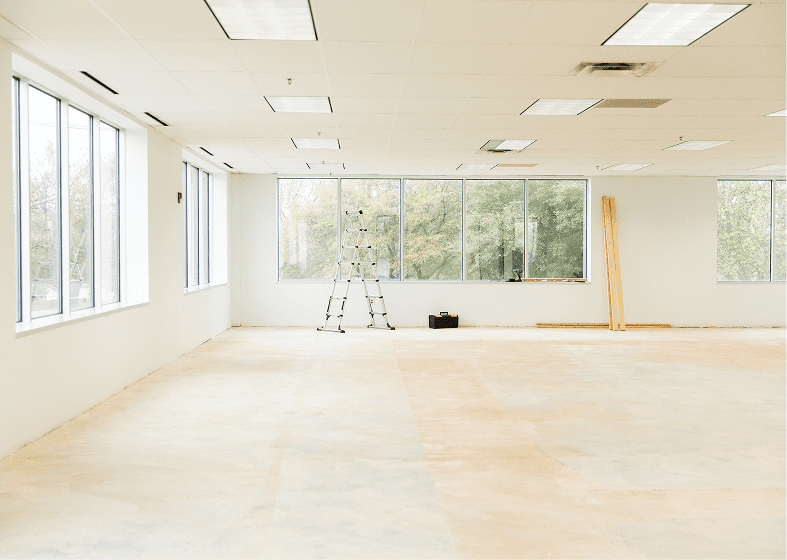 Bright, unfurnished room with ladder