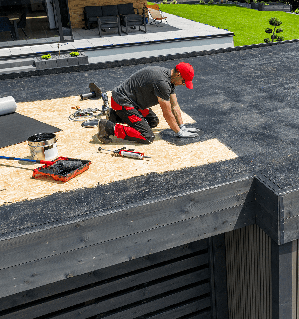 Man working on building roof maintenance